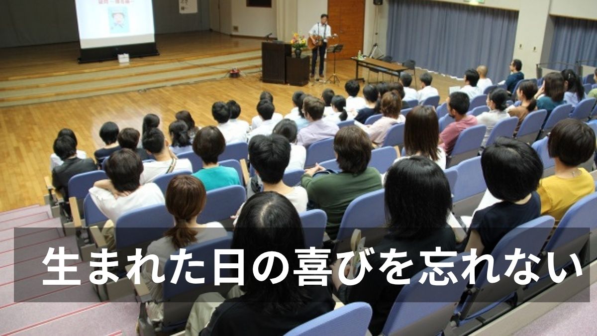 中学校保護社会で歌う石川達之